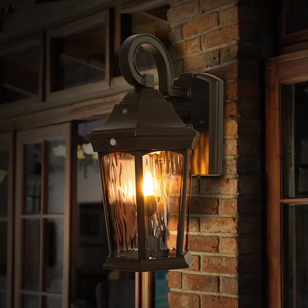 15.9 In. Bronze Integrated LED Outdoor Wall Light Lantern Sconce with Flickering Bulb, Motion Sensor, and Photocell