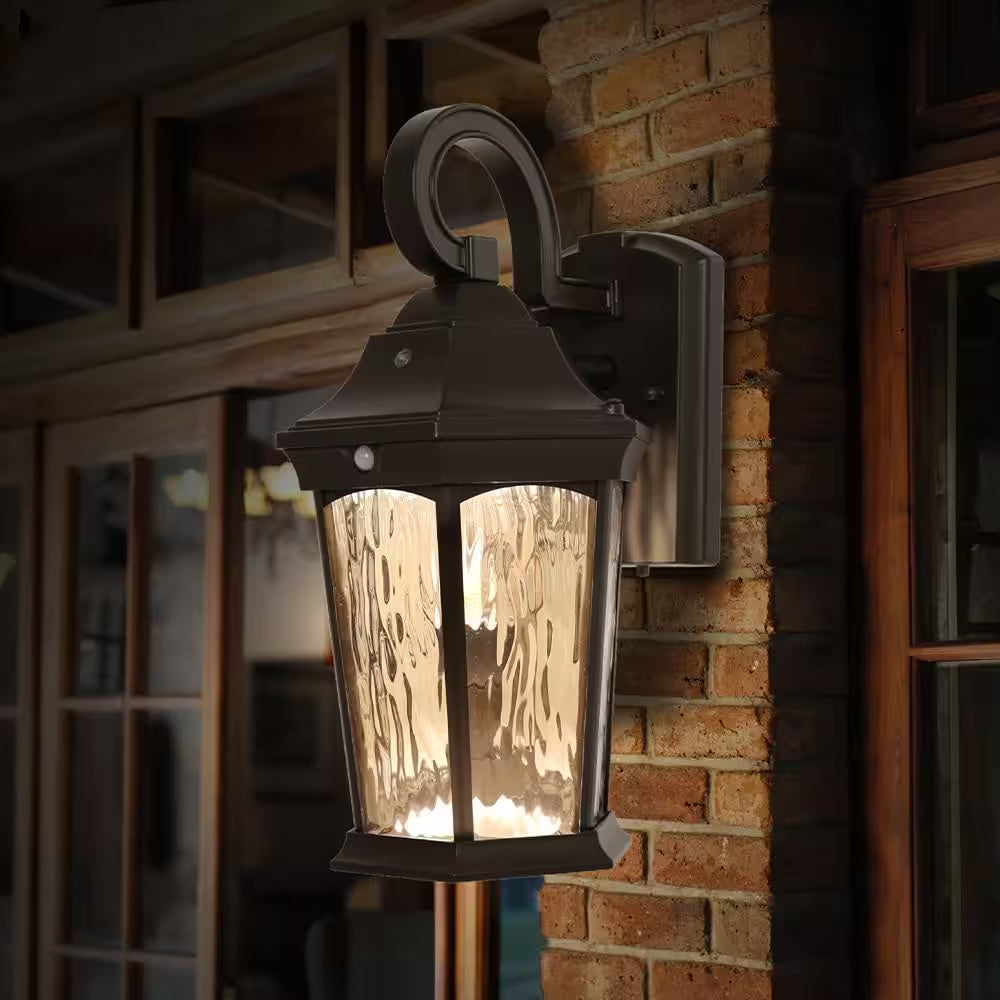 15.9 In. Bronze Integrated LED Outdoor Wall Light Lantern Sconce with Flickering Bulb, Motion Sensor, and Photocell